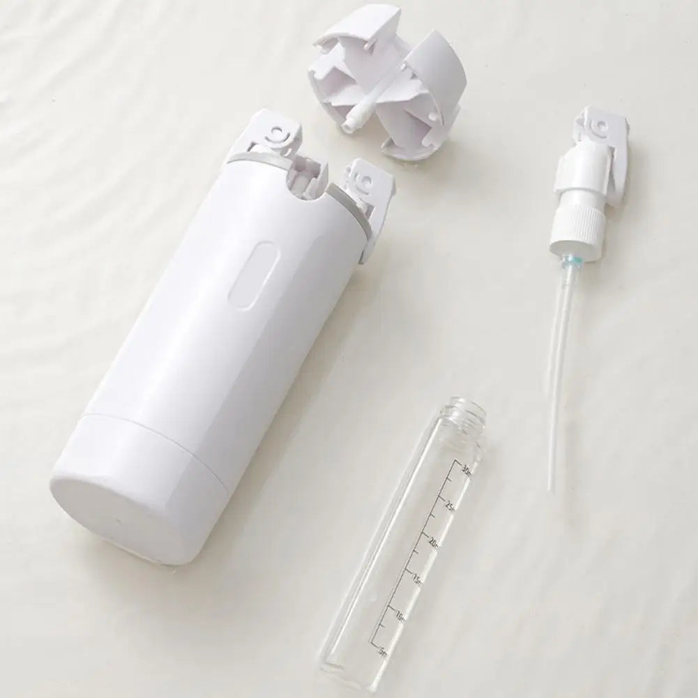 Travel Split Bottle components including a white wash bottle, spray nozzle, and measuring container.